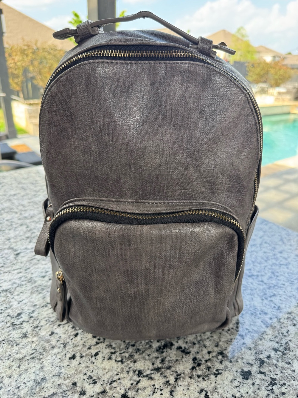 MMS Design Studio gray faux leather backpack